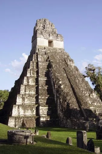 The Temple of the Great Jaguar (Tikal Temple I) in Guatemala against a blue sky